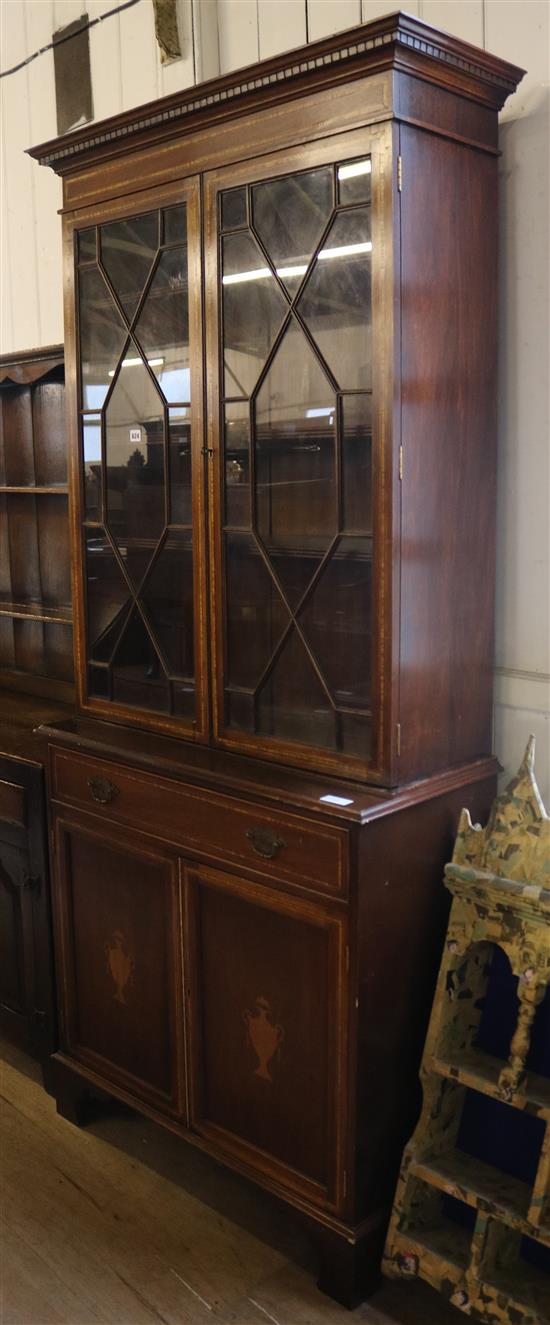 Inlaid mahogany glazed bookcase(-)